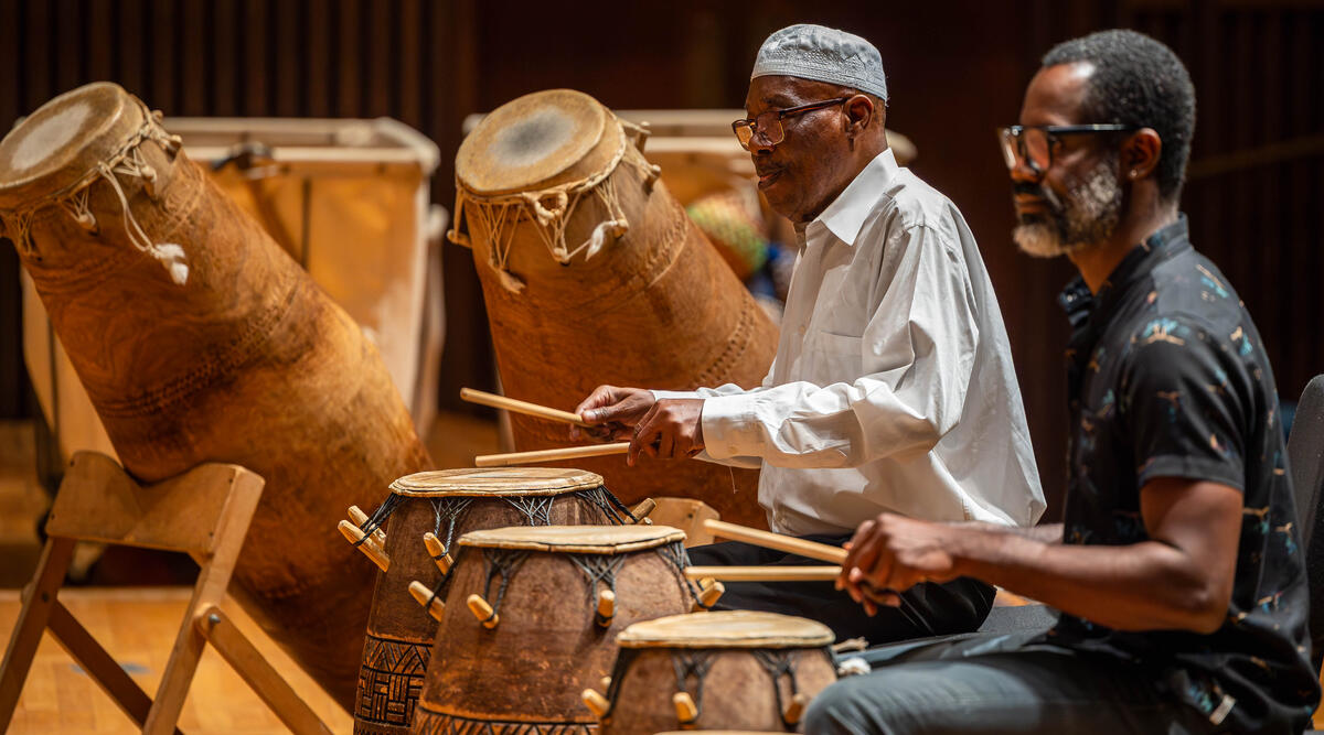 Instructors demonstrating instruments during the African Music Ensemble class