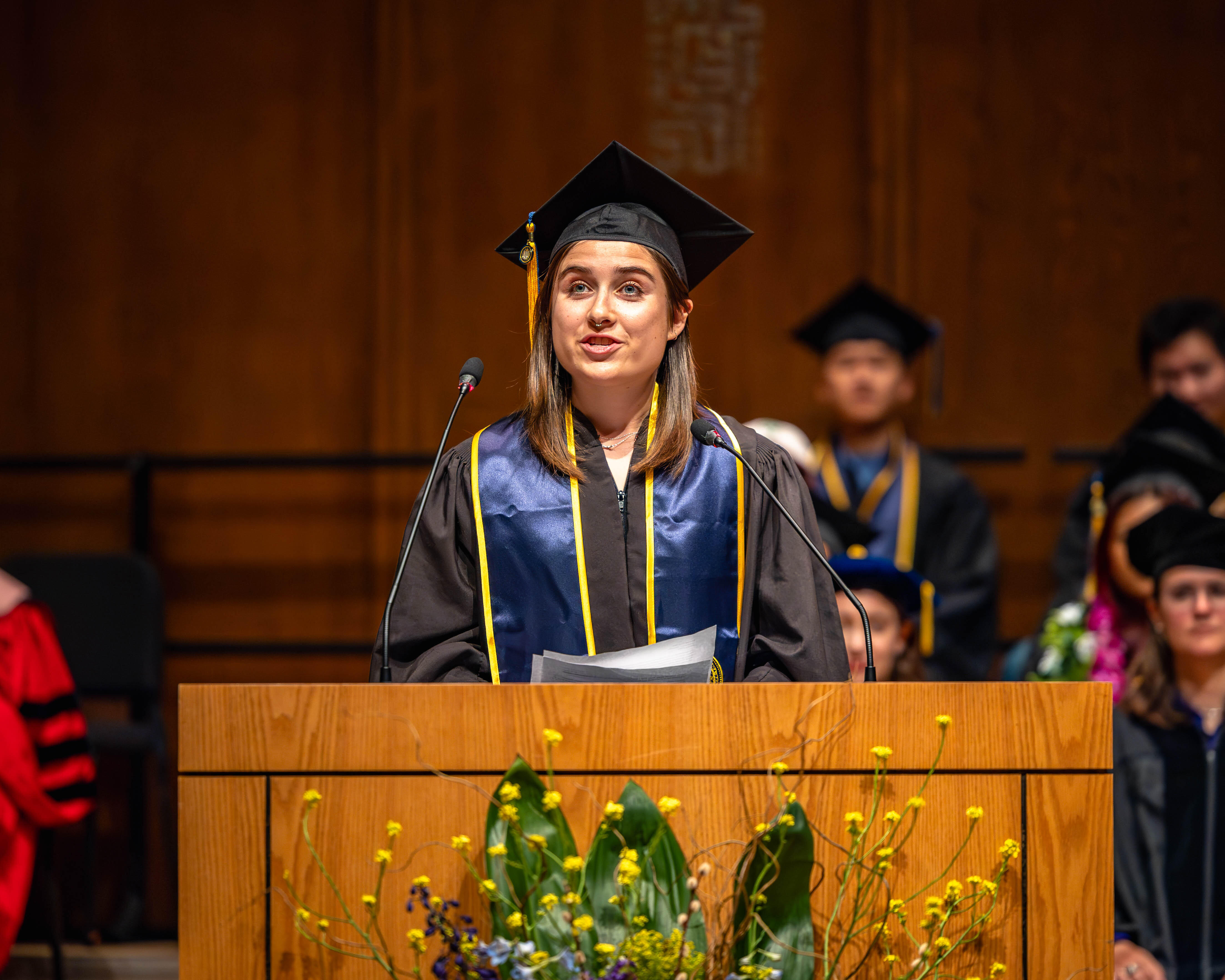 Audrey Chandler speaks to her fellow department graduates