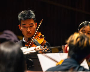 A student performing in the UC Berkeley Philharmonia Orchestra